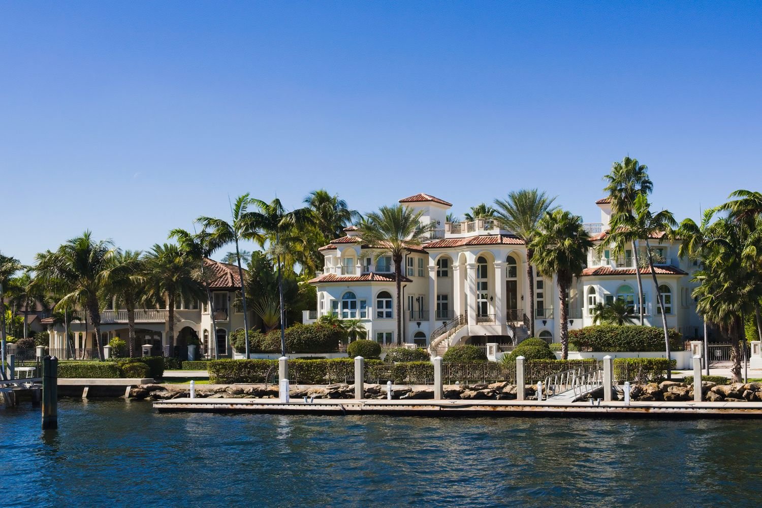 A different coastal home with mature landscaping photographed for Beverly Grove's closing invitation